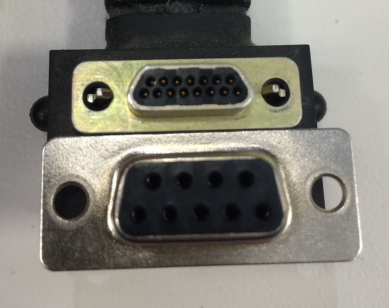 A nine-pin and a fifteen-pin D-subminiature connector side by side.