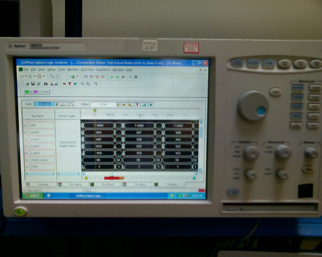 A benchtop logic analyzer with a wide screen and rows of input channels.
